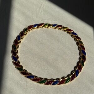 Vintage gold-tone metal necklace with multi-color enamel leaf designs